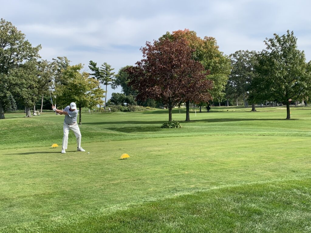 Golfer preparing to tee off