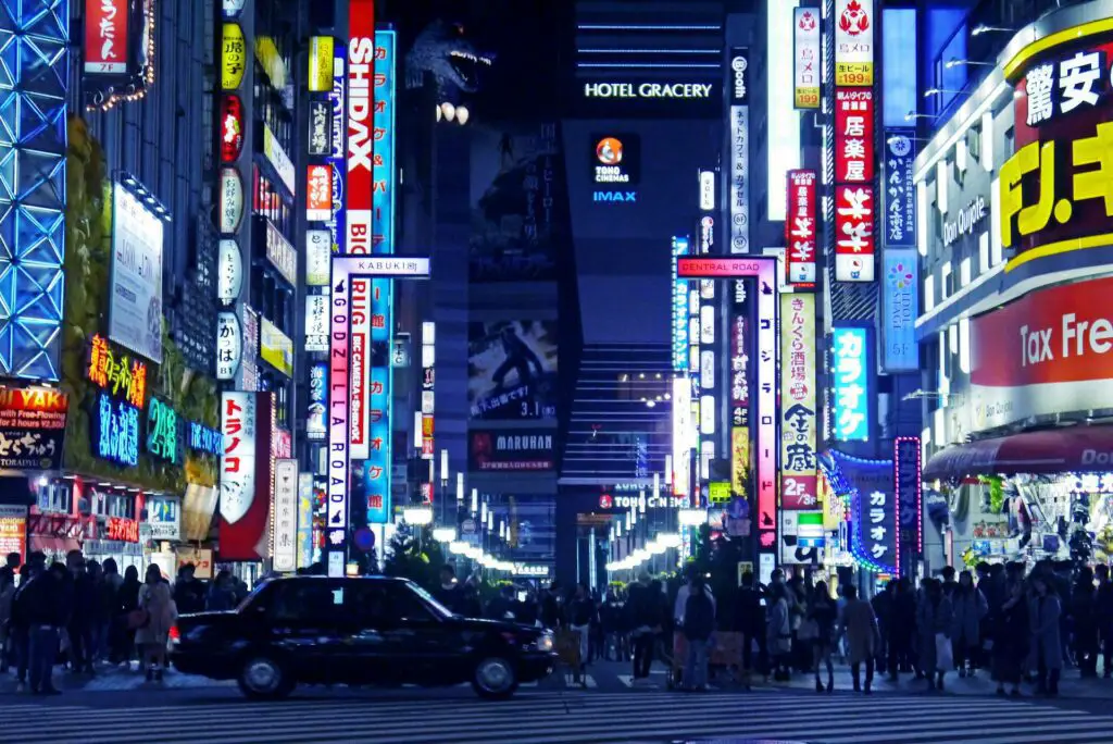 a street with many signs and people