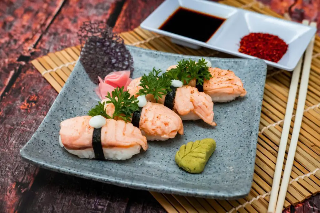 a plate of sushi on a bamboo mat