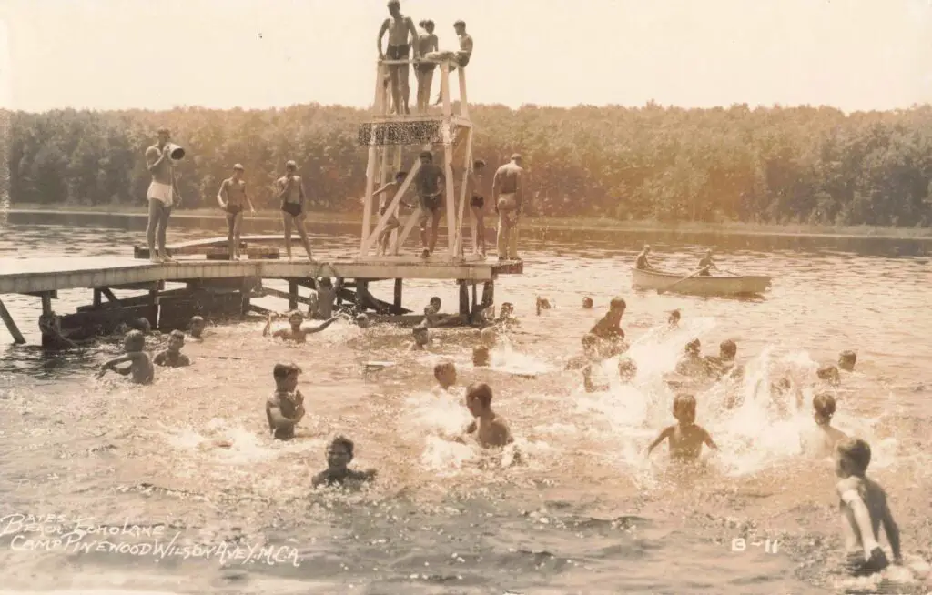 a group of people swimming in a lake