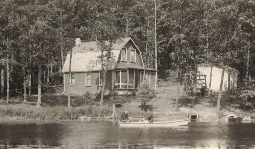 a couple of men in a boat on a lake