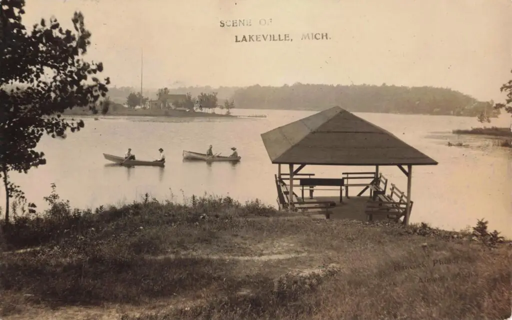 a group of people in canoes on a lake
