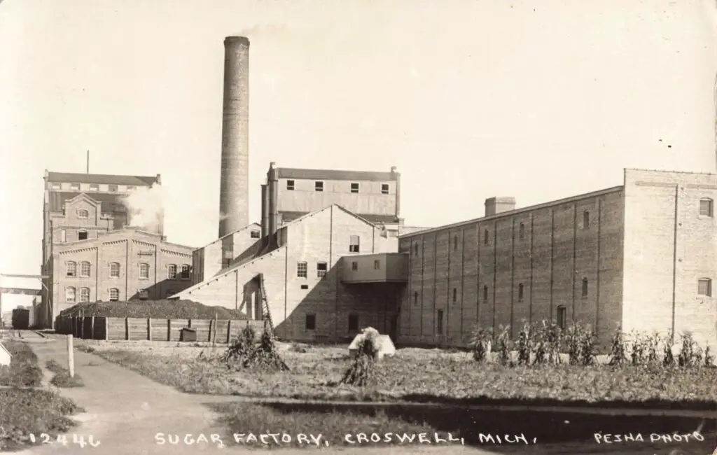 a factory with smoke coming out of the building
