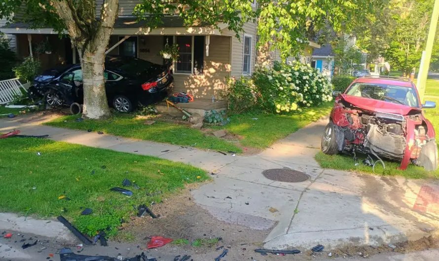 Lexington Car Crash Damages Home – Morning Collision Sends Two to Hospital