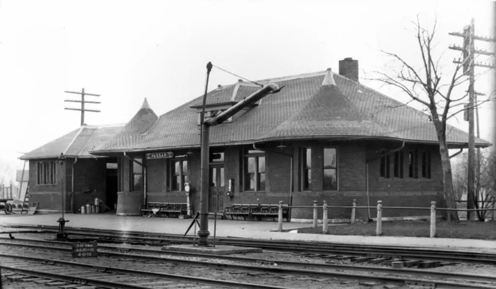 a train station with a building