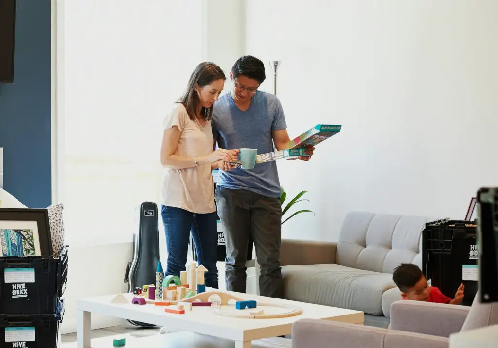 a man and woman standing in a living room