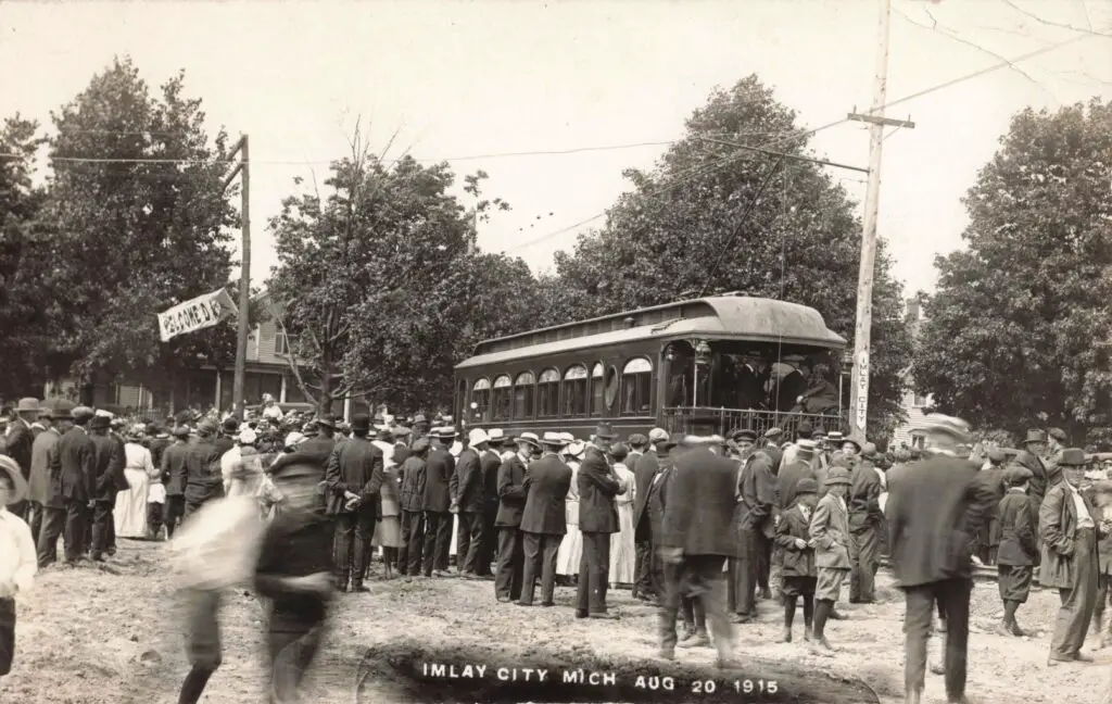 a group of people standing around a trolley