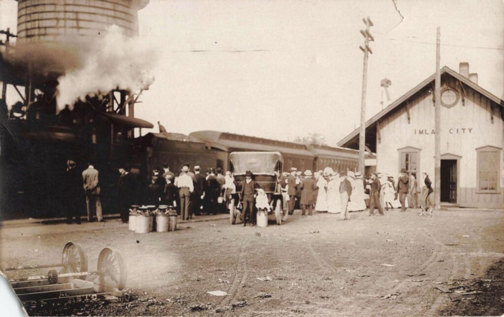 a group of people standing next to a train