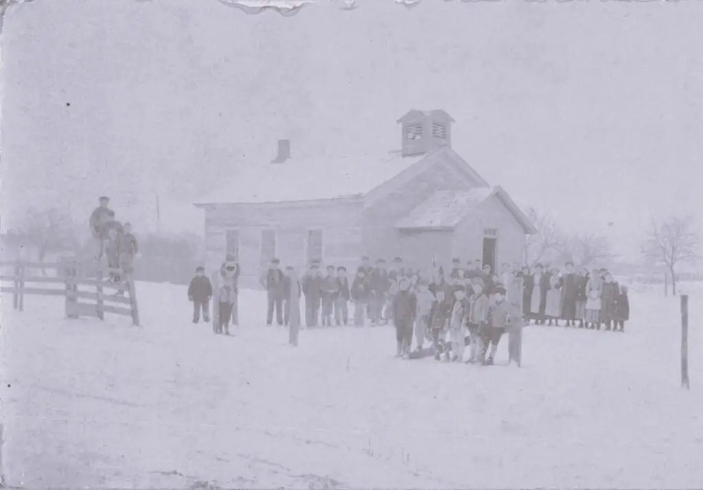 a group of people standing in the snow