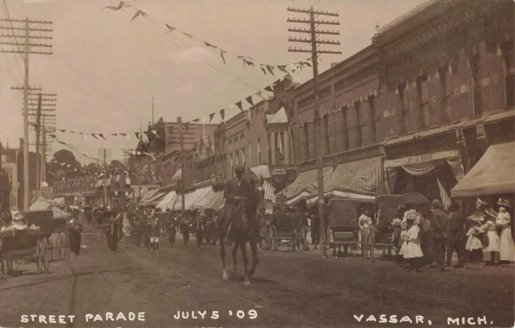 a group of people riding horses in a street