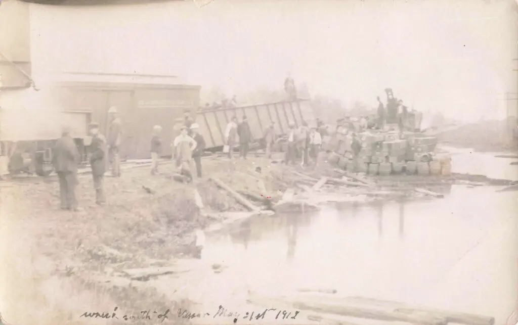 a group of people standing next to a large truck