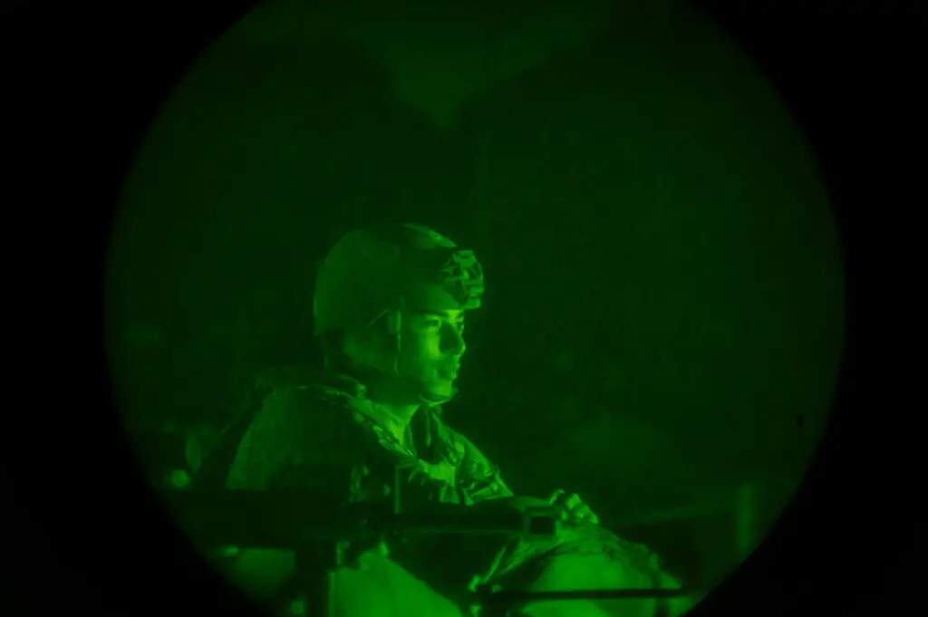 a soldier in a dark room
