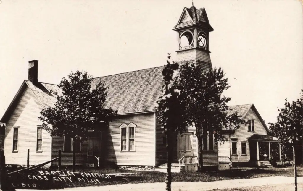a church with a clock tower - First Baptist Church in Cass City