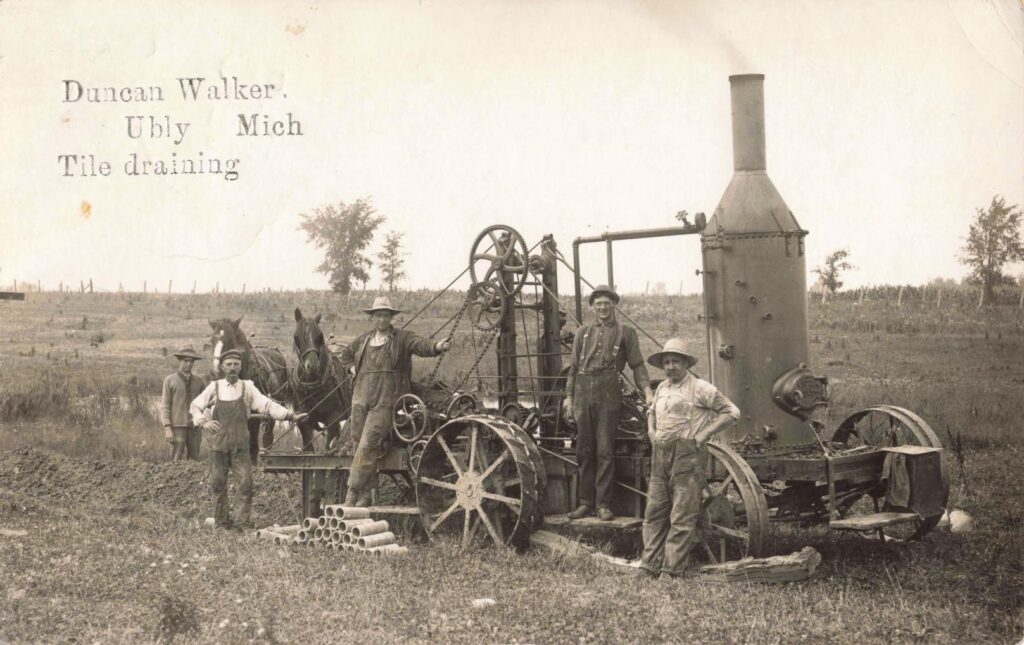 Historical farming machinery and workers.