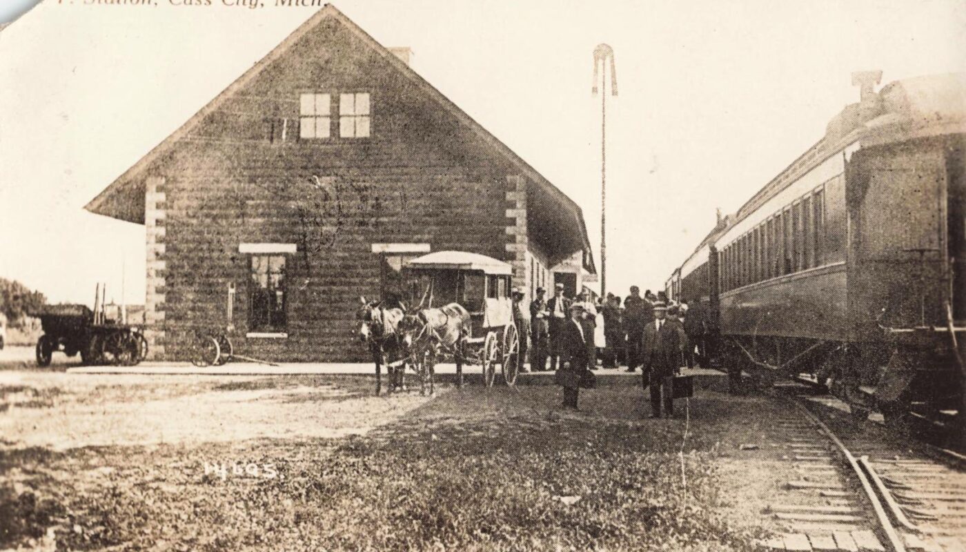a group of people standing outside a train station