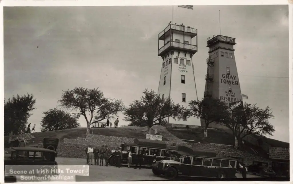 a group of people standing in front of a tower