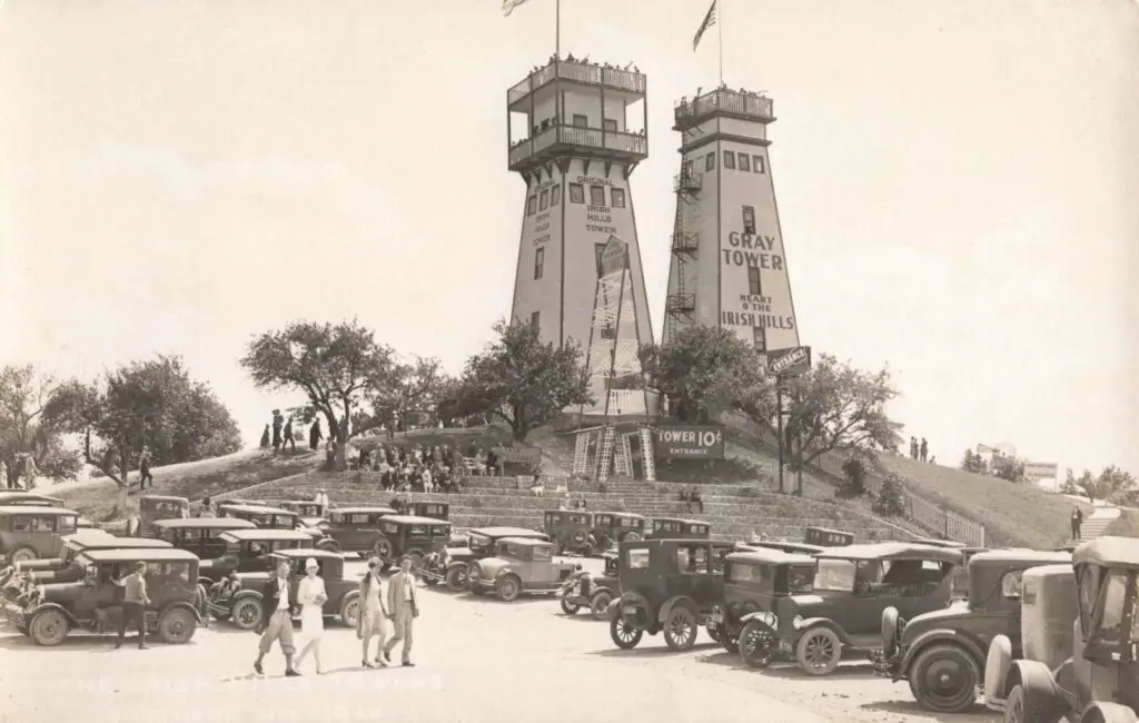 a group of cars parked in front of a tower