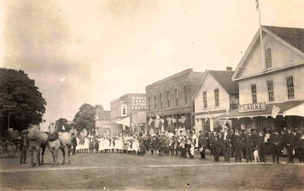 a group of people standing in a street