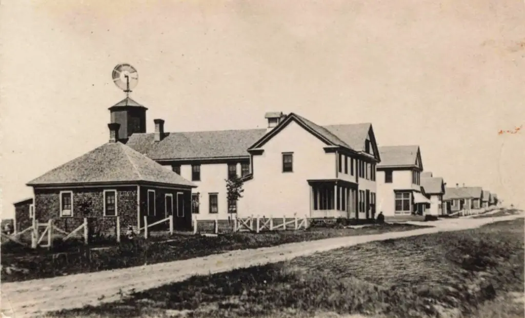 Historic buildings along a dirt road.