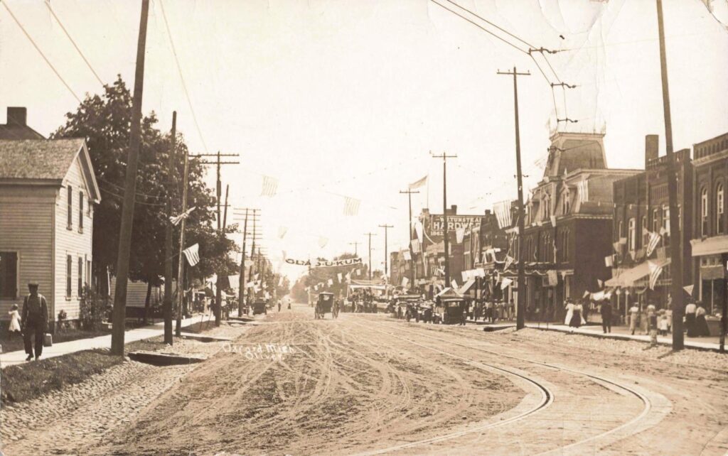 Historic street with early 1900s architecture.