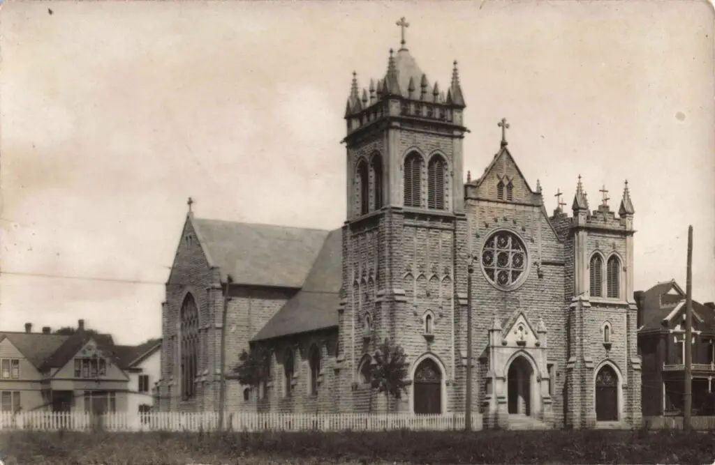 Historic stone church with towers.
