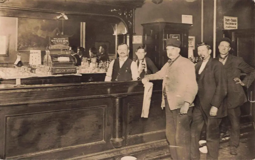 Group of men at a bar.
