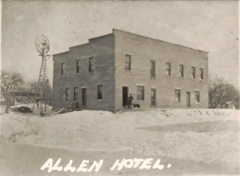 Historic hotel in snowy landscape.