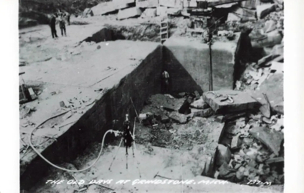 Historic mining site with workers