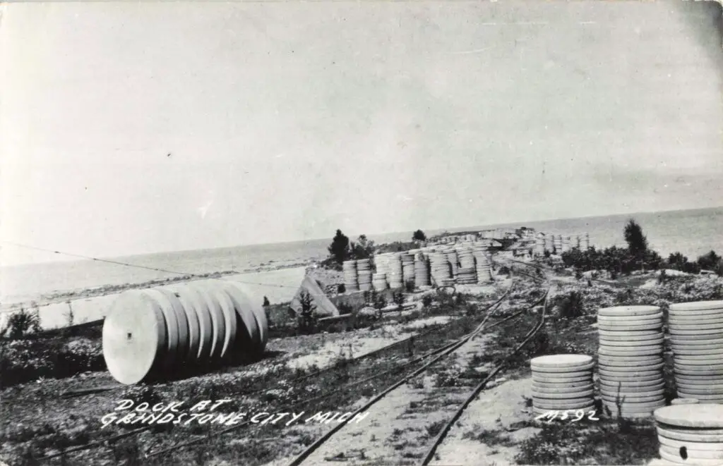 Old dock with cylindrical containers.