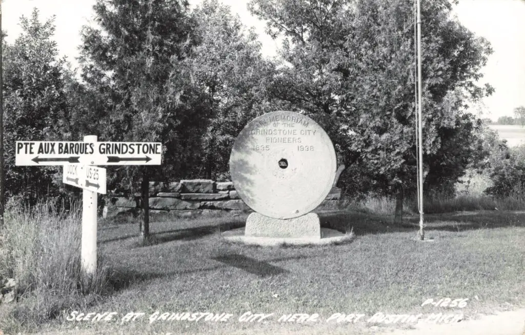 Grindstone memorial in rural area.
