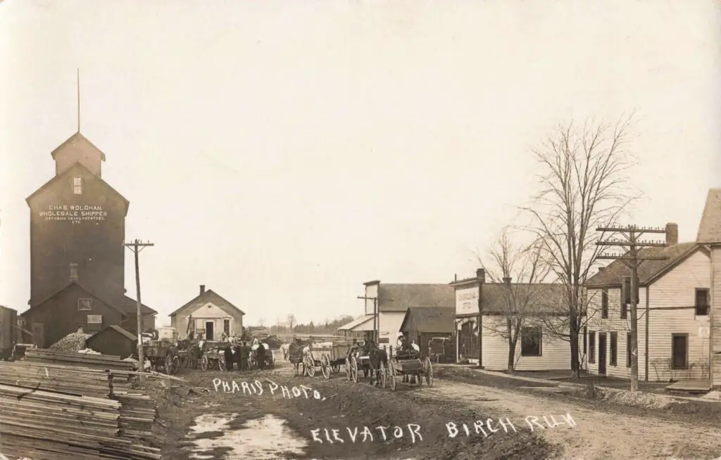 Historic grain elevator and horse-drawn wagons