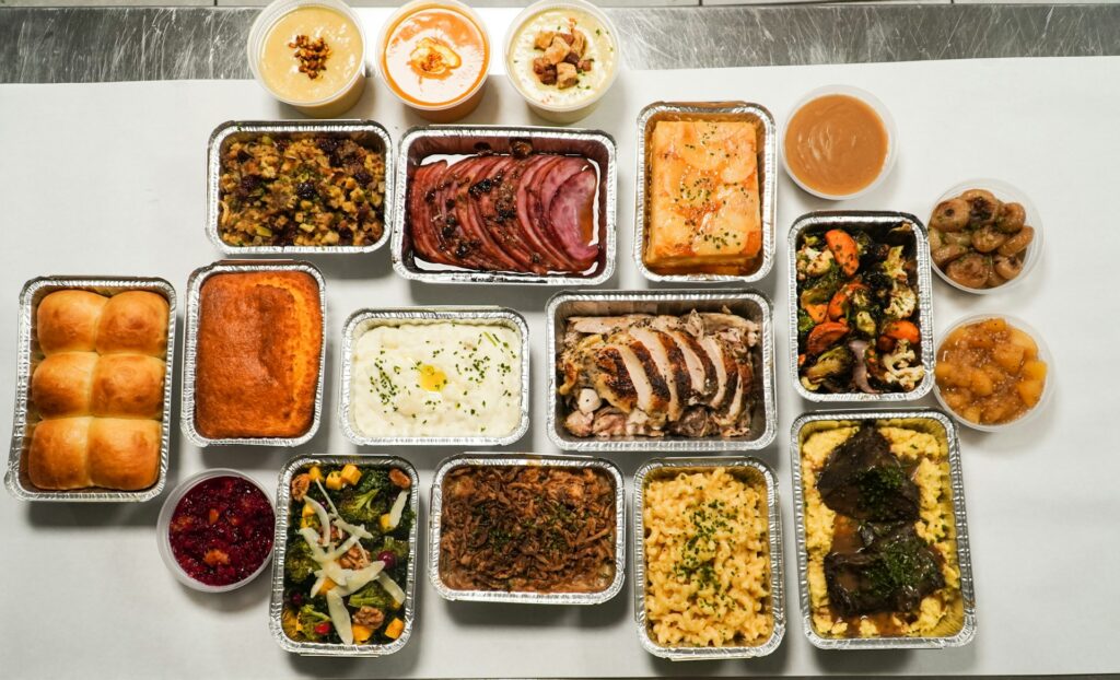 Variety of prepared meals in containers.