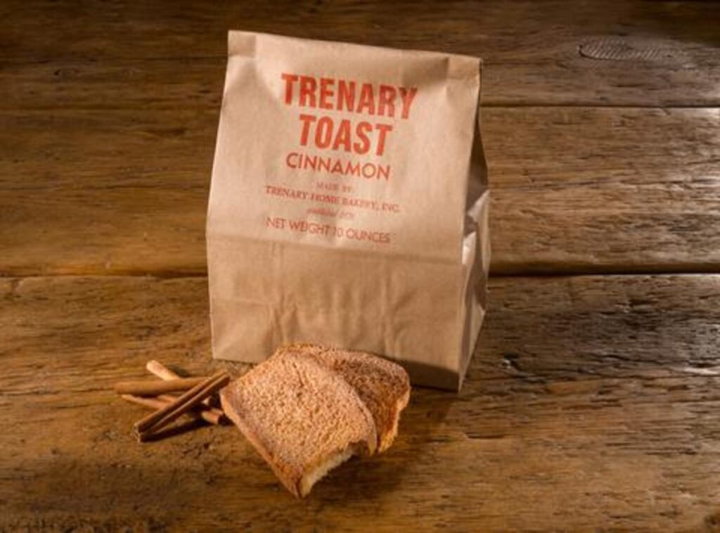Cinnamon toast with packaging on wood