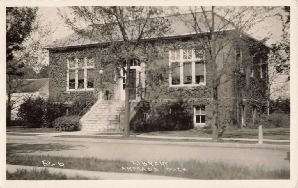 Armada Free Public Library (1915): Ivy-covered Carnegie building with broad steps.