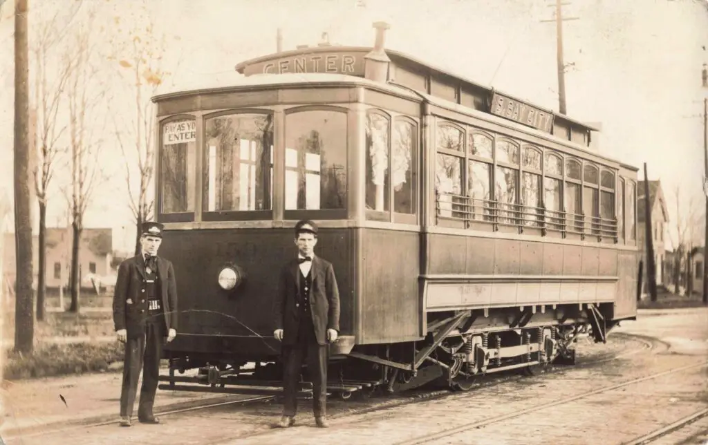 Vintage streetcar with two men.