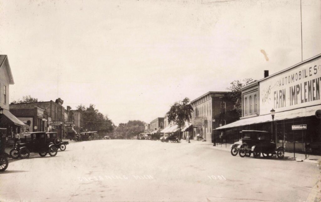 Historic street with vintage cars.