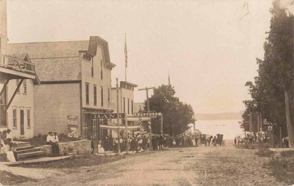 Historic street scene with buildings and people.