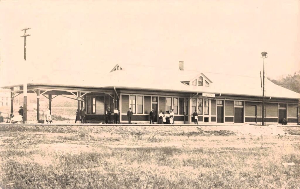 Historic train station with people gathered