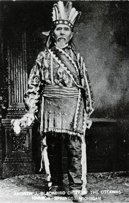 Indigenous chief in traditional attire.