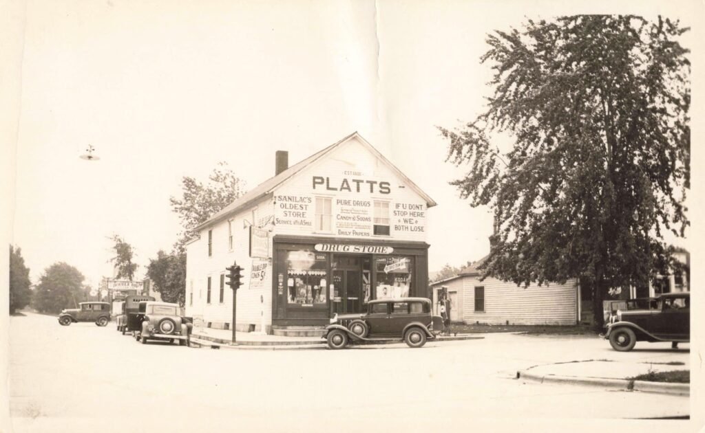 Historic Platts drug store with vintage cars
