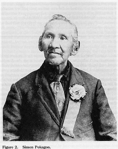 Elderly man in formal attire.