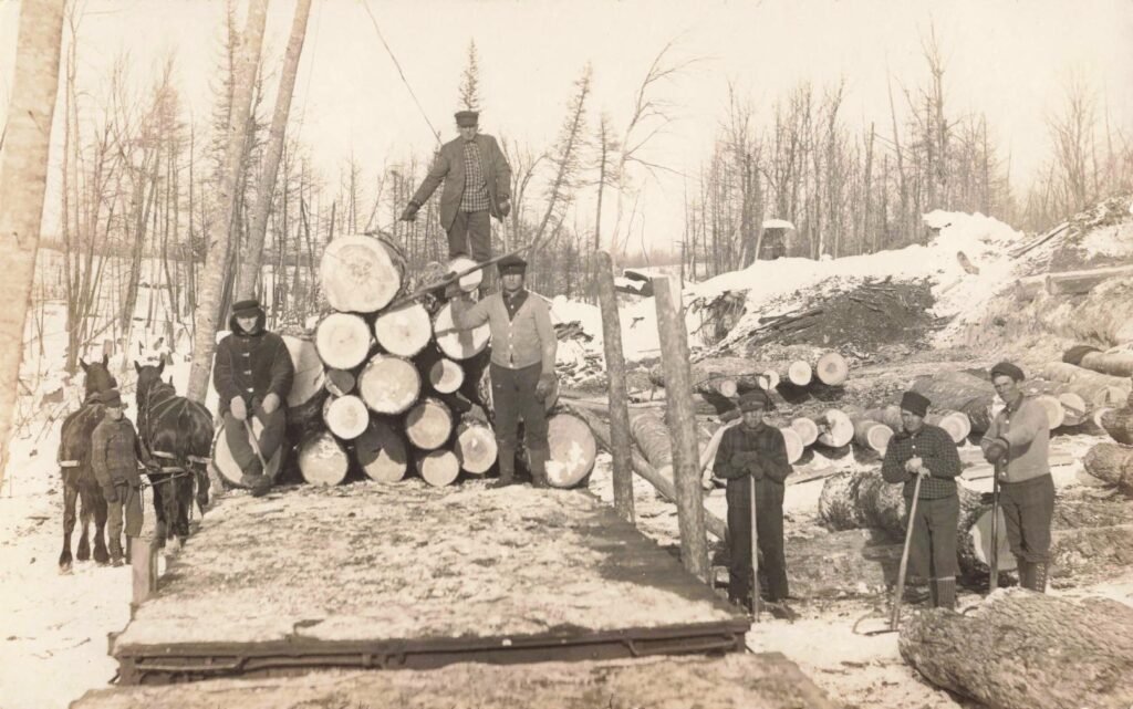 Historical logging scene in winter.