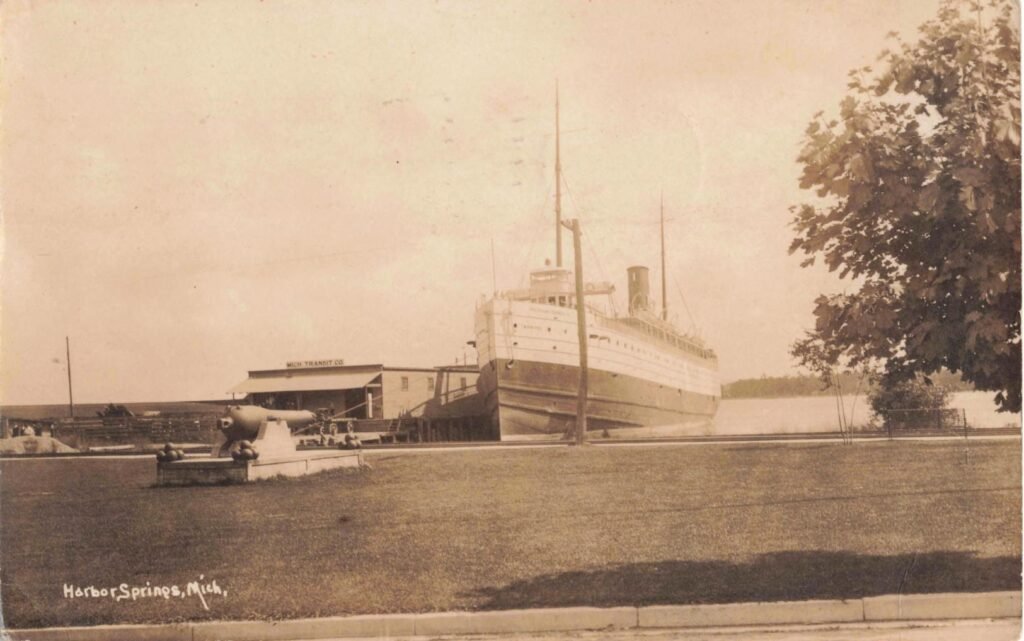 Historic ship docked near shore.