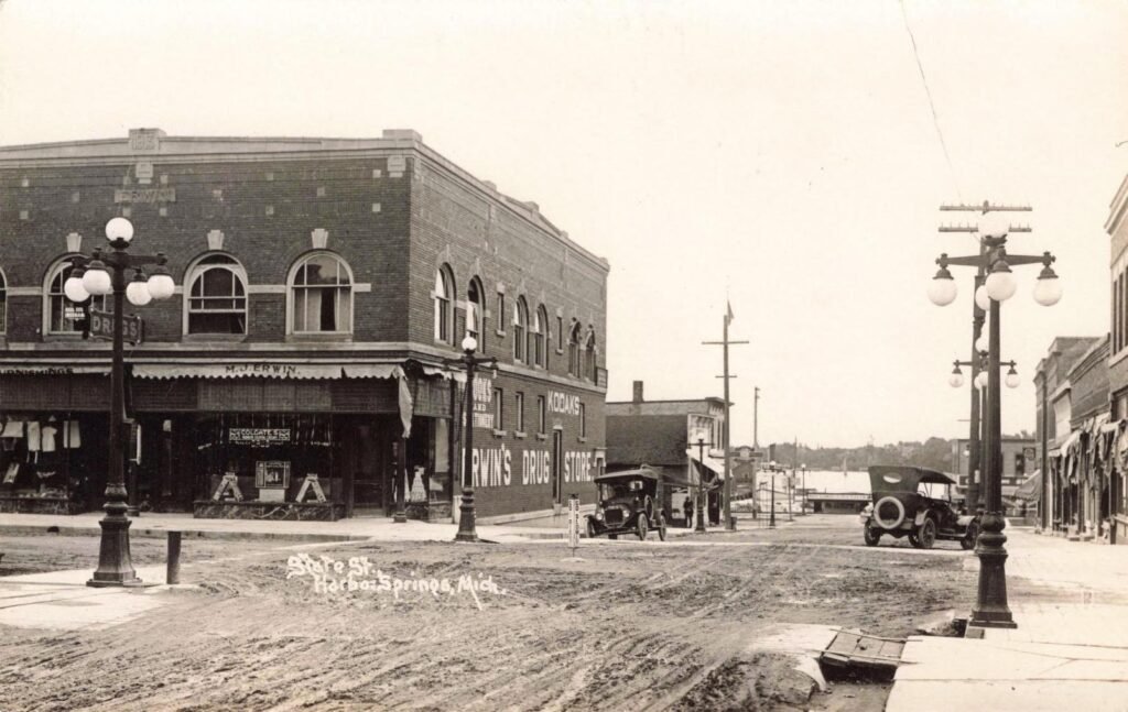 Historic street scene with vintage cars.