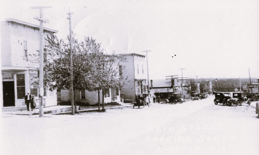 Historic street with vintage cars.