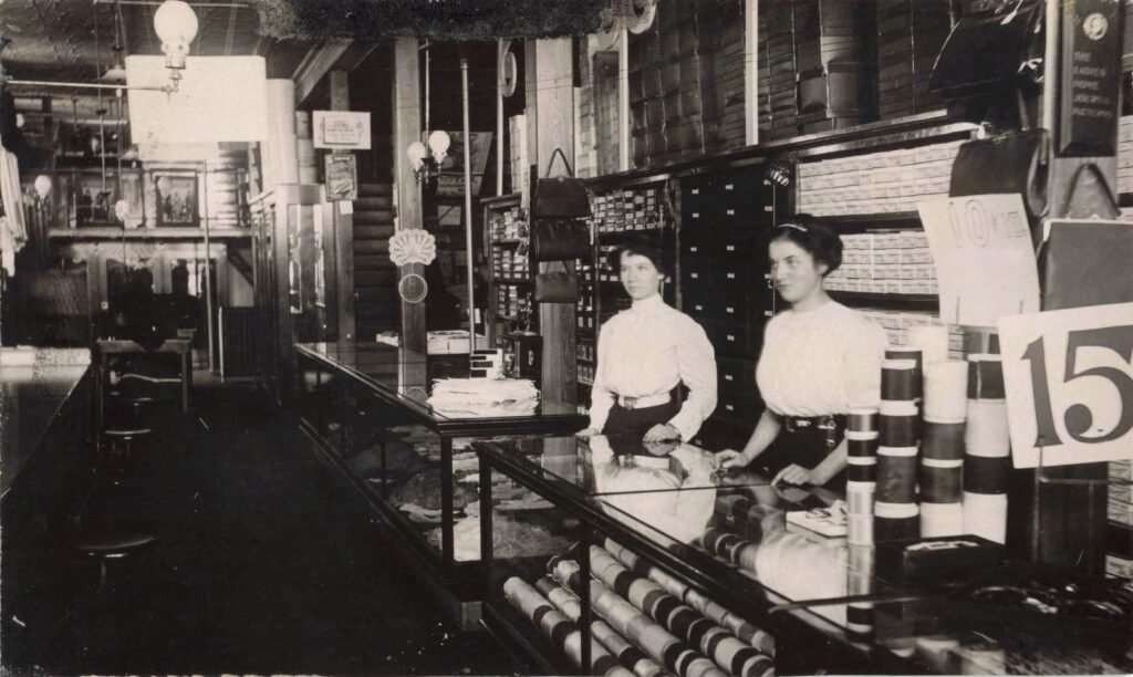Historic store interior with employees.