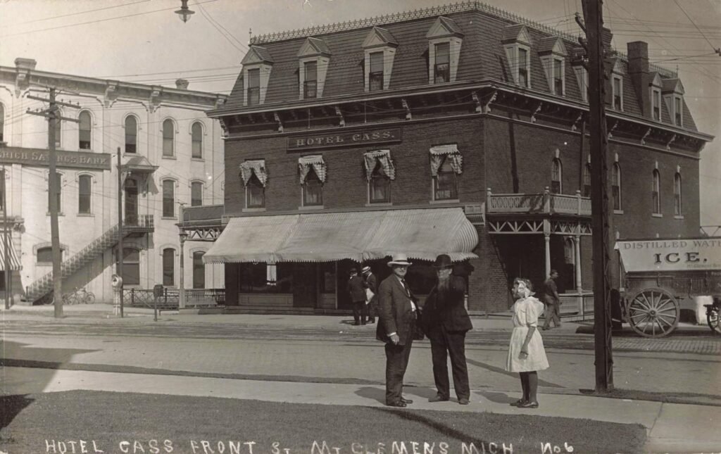 Historic hotel with people outside.