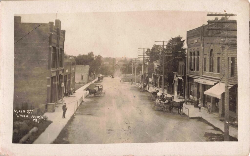 Historic street with horse-drawn carriages
