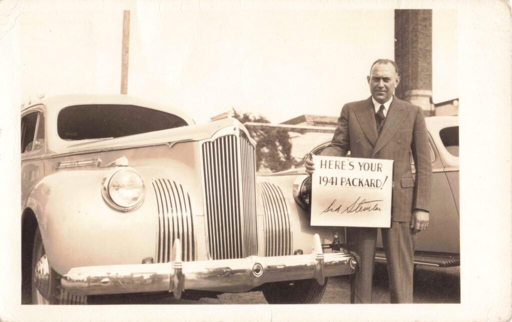Man with 1941 Packard car.