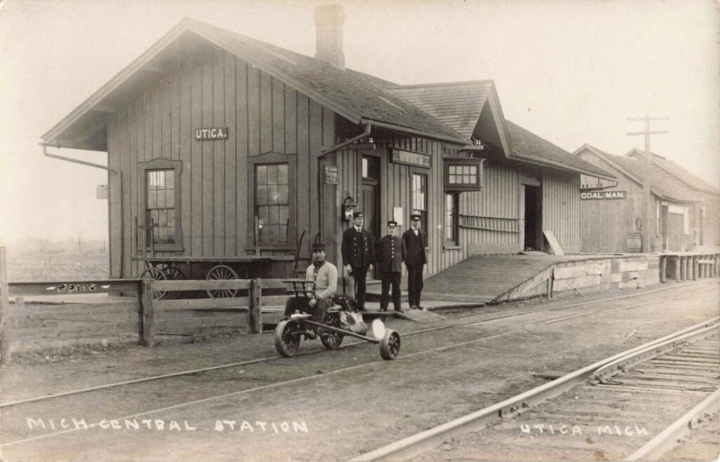 Historic train station with people.